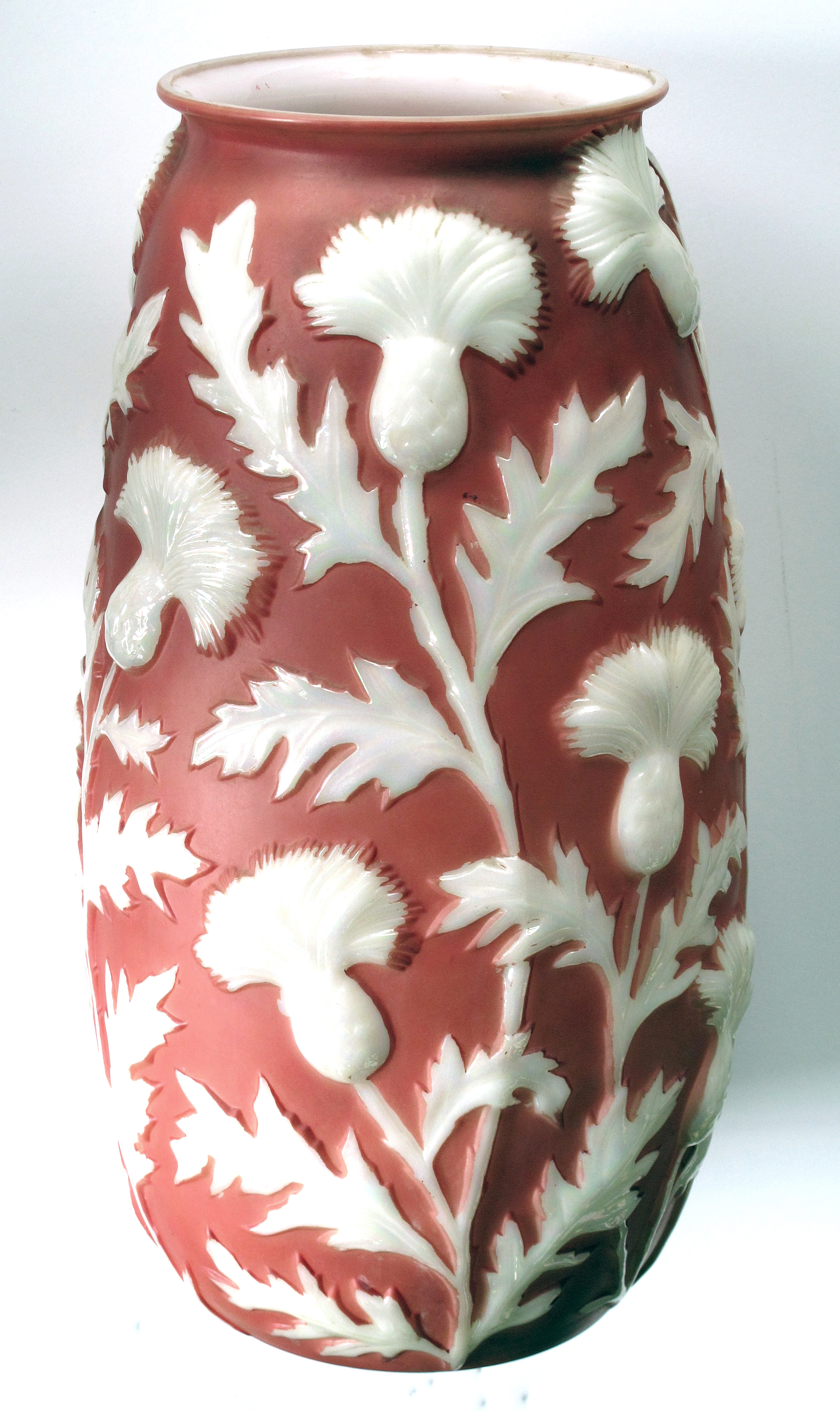 a tall american 1960's sculpted art glass vase of frosted coral