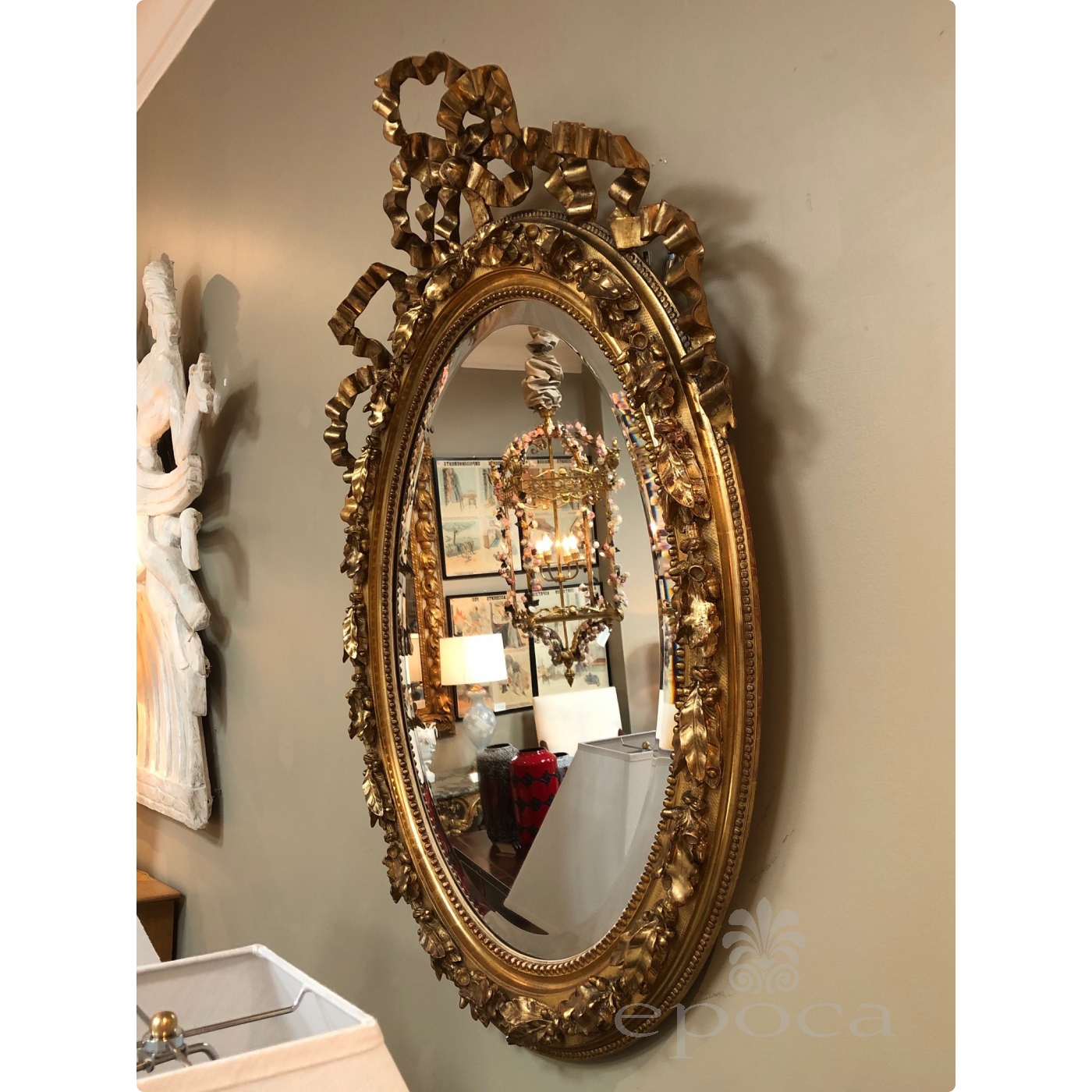 A French Napoleon III Giltwood and Composite Oval Mirror with